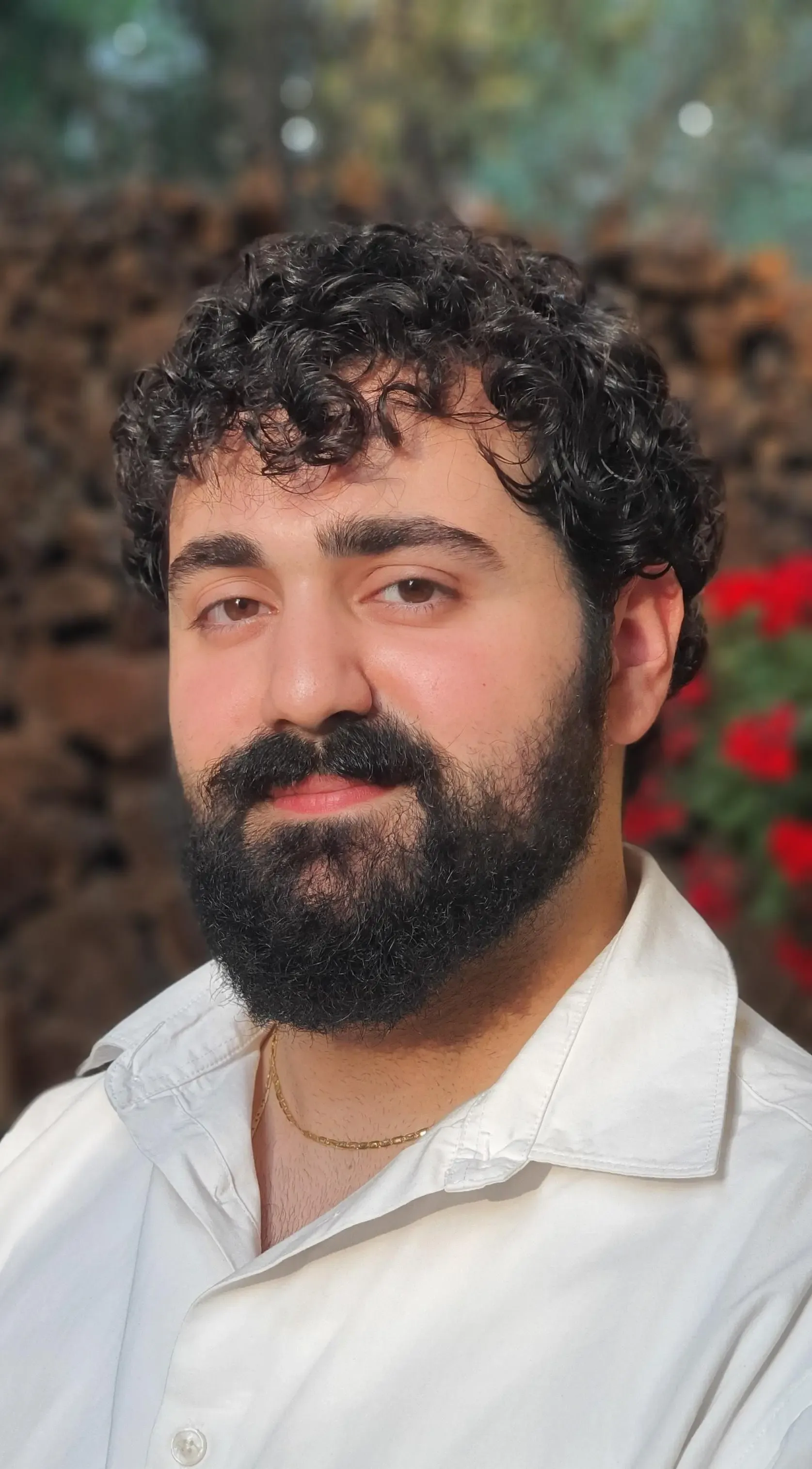 Portrait of Psychologist Firas Al Alam showing his face with a blurred background of nature